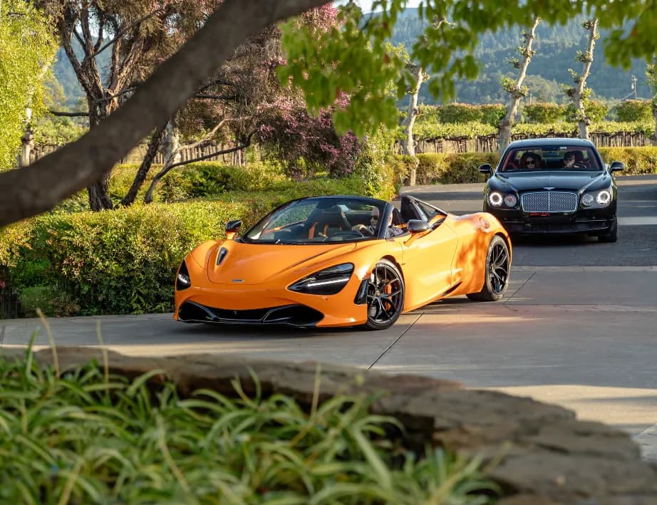 McLaren 720S Performance Spider finished in orange, outer view; convertible roof visible McLaren 720S Performance Spider finished in orange, outer view; convertible roof visible