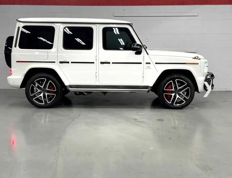 Mercedes-Benz G Wagon finished in white, outer view; running boards visible Mercedes-Benz G Wagon finished in white, outer view; running boards visible
