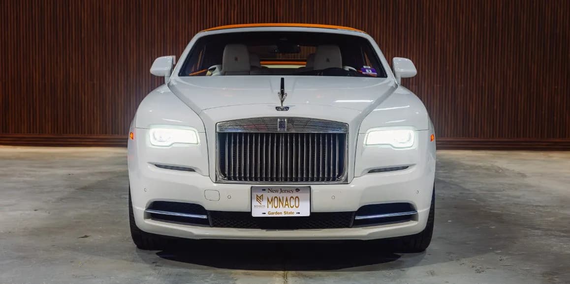 Rolls-Royce Dawn (Hermes) finished in white, outer view; convertible roof visible Rolls-Royce Dawn (Hermes) finished in white, outer view; convertible roof visible