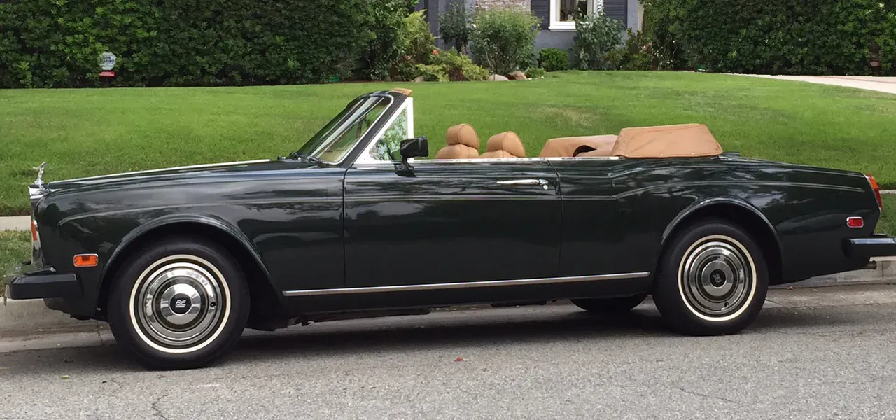 Green 1983 Rolls-Royce Corniche Convertible exterior with convertible roof, photo 11 for wedding car rental in Northridge, CA