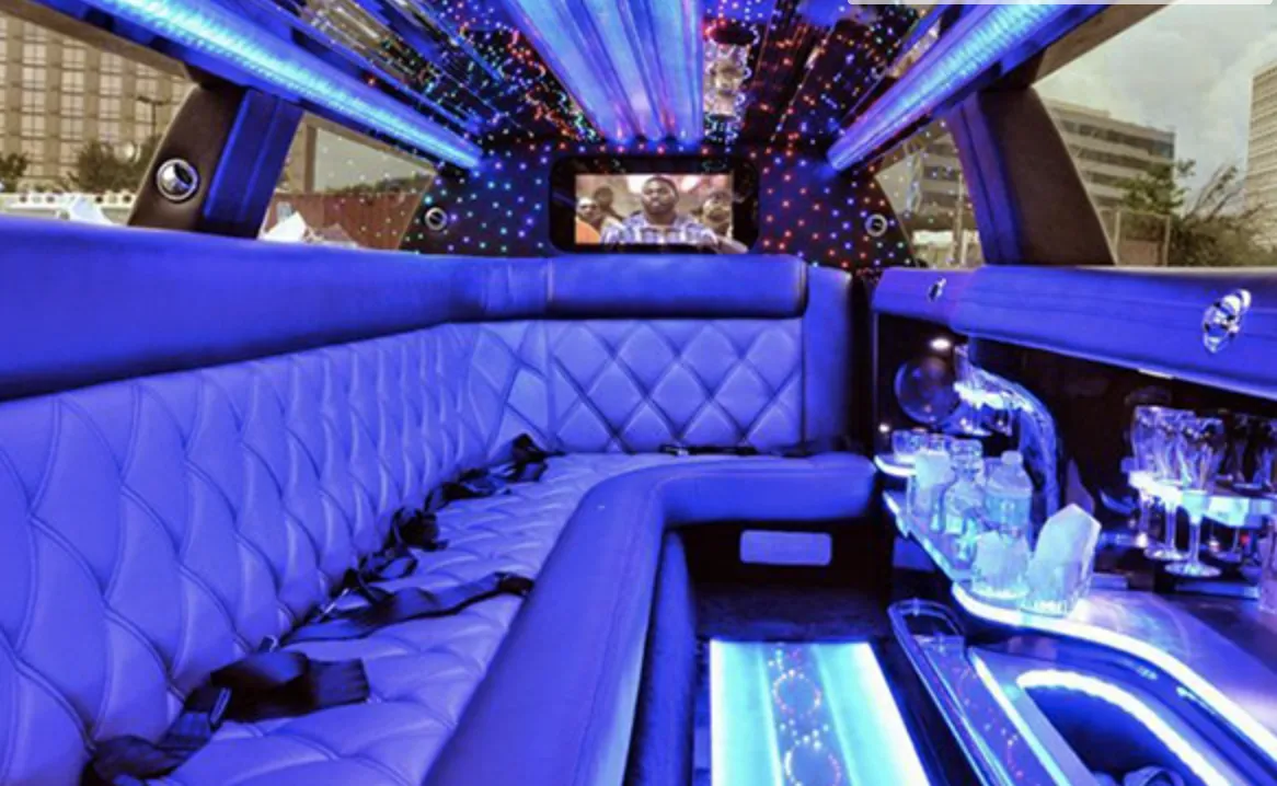 C300 Limousine C300 Limousine interior with sofa-style seating, LED accent lighting and LED ceiling lighting for wedding car rental
