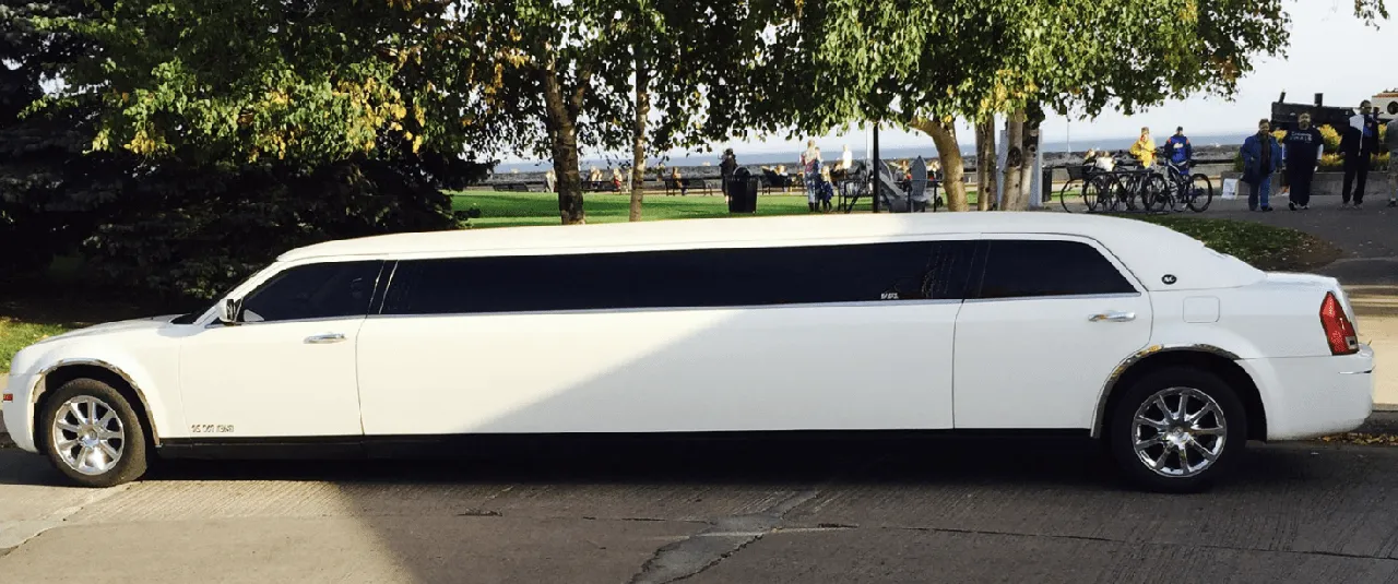 White C300 Limousine exterior with tinted windows for wedding car rental