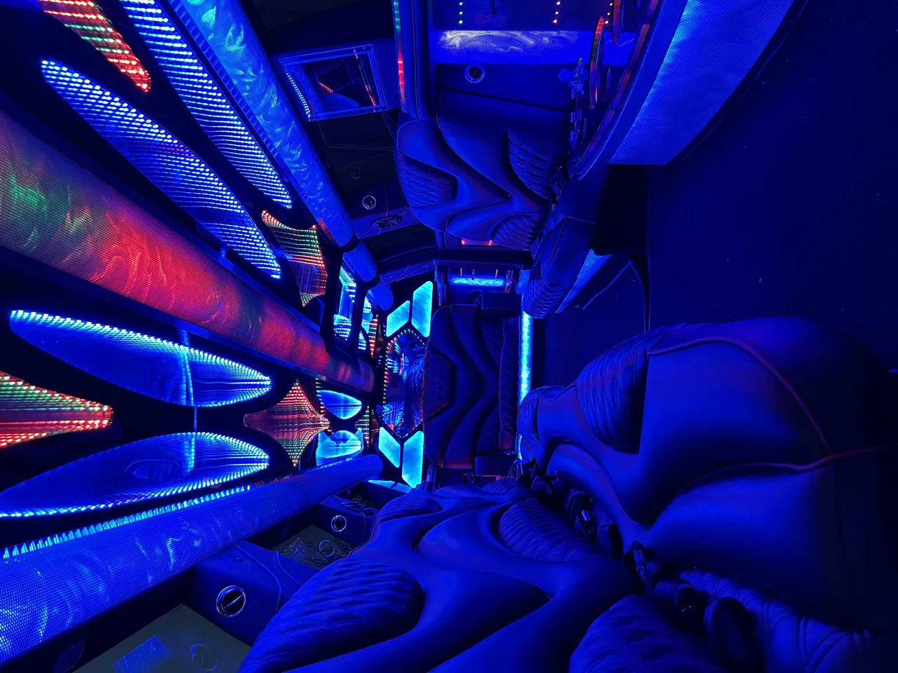 Cadillac Escalade Limousine interior with LED accent lighting and LED ceiling lighting for wedding car rental