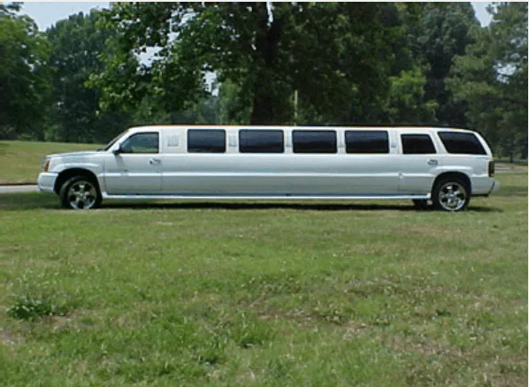 Cadillac Escalade Limousine finished in white, outer view; tinted windows visible