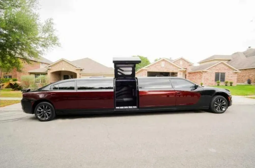Charger Limousine Black Charger Limousine with tinted windows and bridal (jet) door for wedding car rental