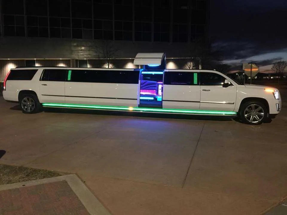 White Cadillac Escalade Limousine with tinted windows and bridal (jet) door for wedding car rental