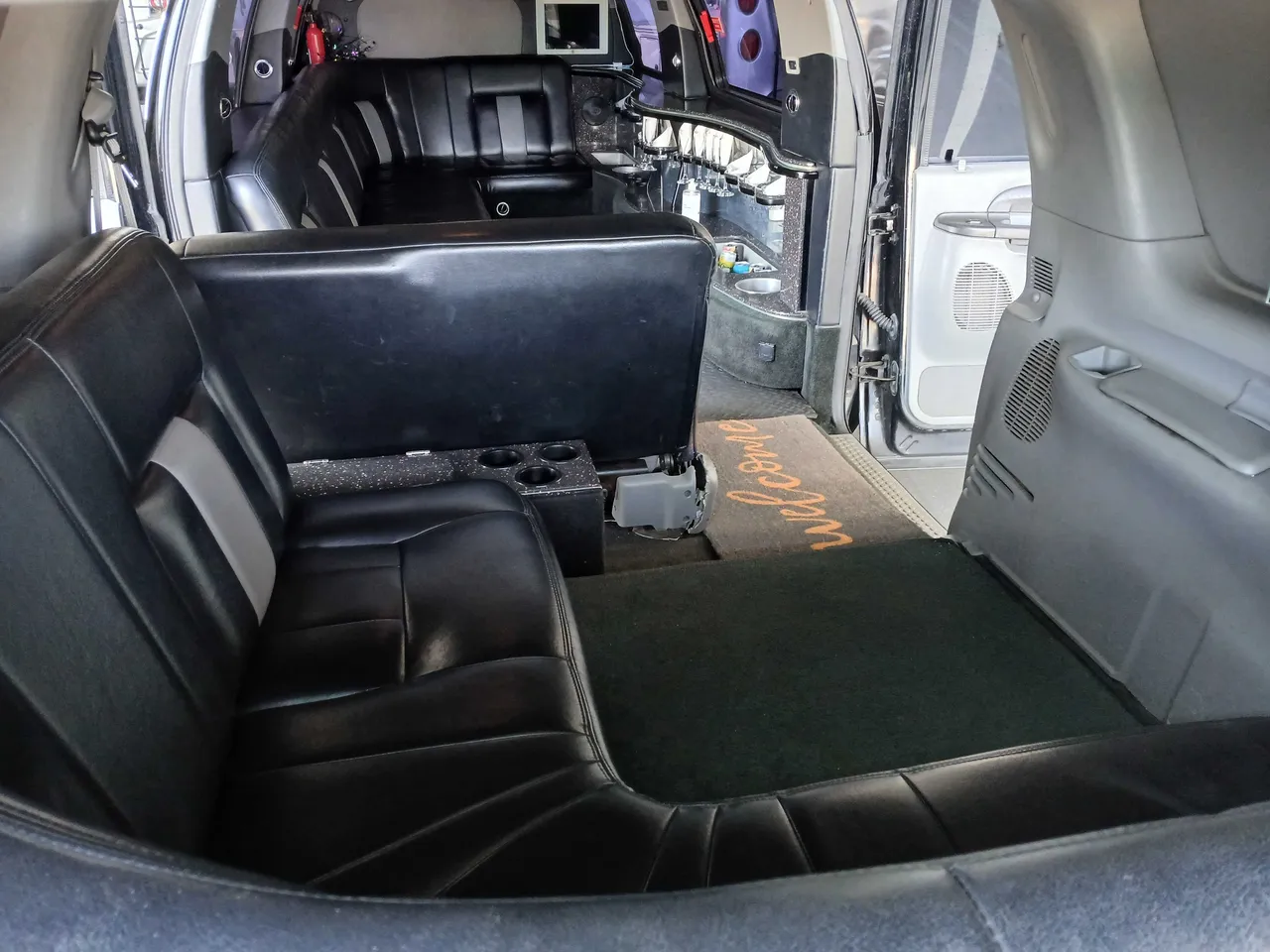 Excursion Limousine interior with cup holders for wedding car rental