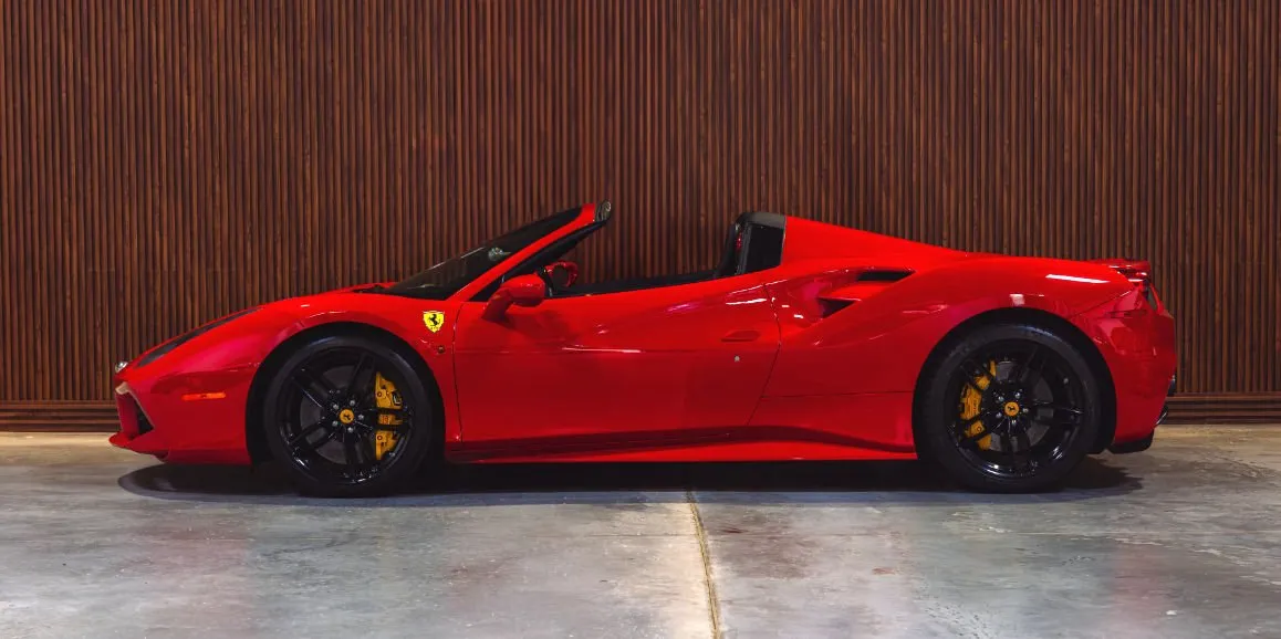 Red Ferrari 488 Spider exterior with convertible roof for wedding car rental in Brodheadsville, PA