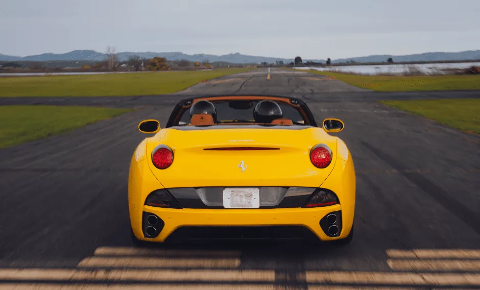 Yellow Ferrari California Convertible with convertible roof for wedding car rental in Napa, CA