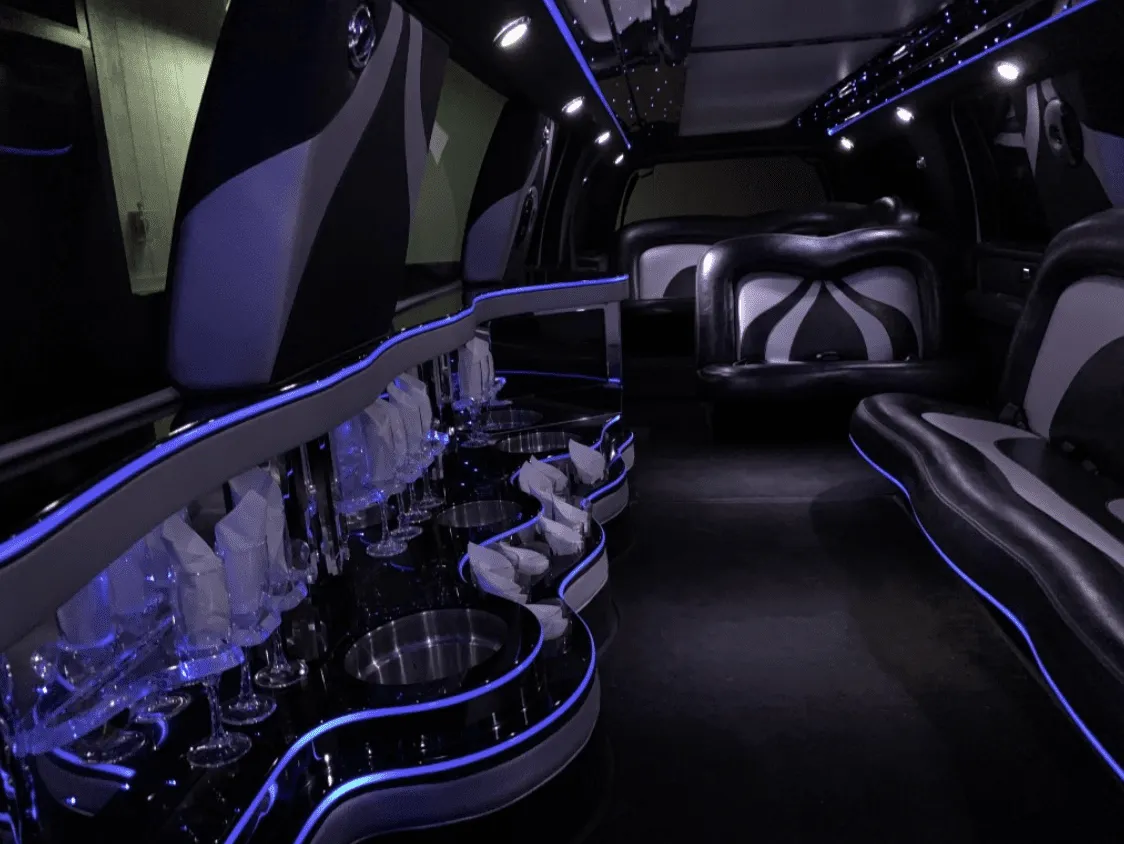 Ford Excursion Limousine Ford Excursion Limousine interior with LED accent lighting and bar area for wedding car rental
