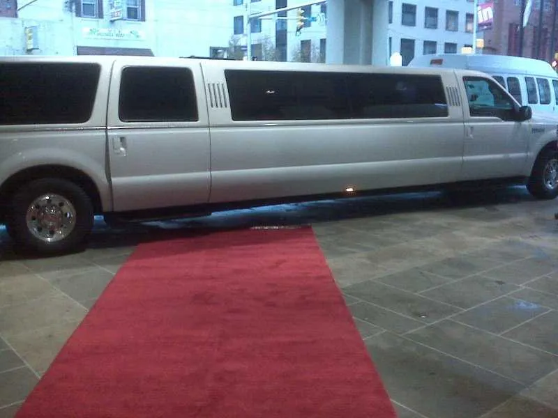 Ford Excursion Limousine White Ford Excursion Limousine with tinted windows for wedding car rental