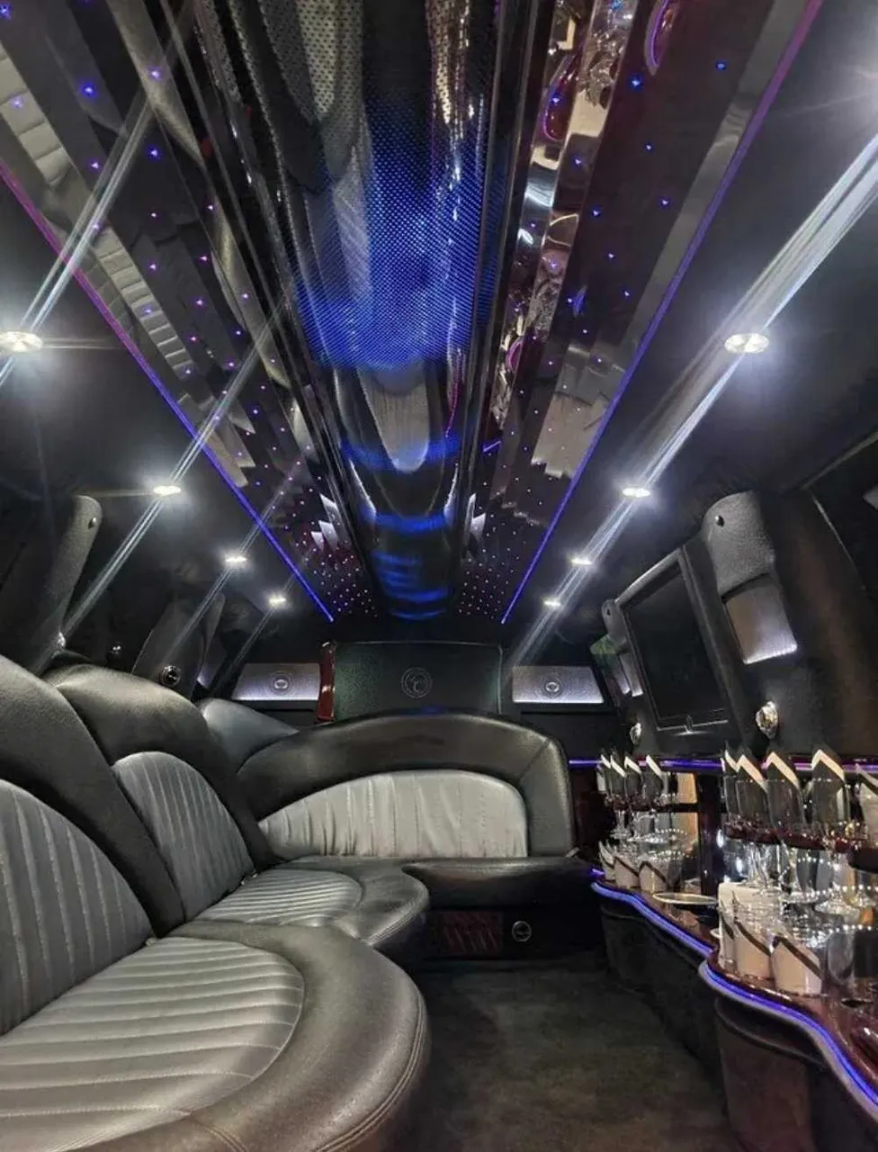 Ford Expedition Limousine interior with LED accent lighting, starlight or fiber-optic ceiling and mirrored ceiling for wedding car rental