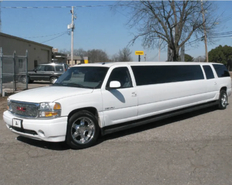 White GMC Denali Limousine exterior with tinted windows for wedding car rental