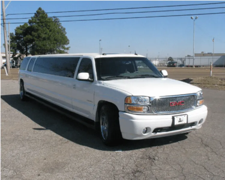GMC Denali Limousine White GMC Denali Limousine with tinted windows for wedding car rental