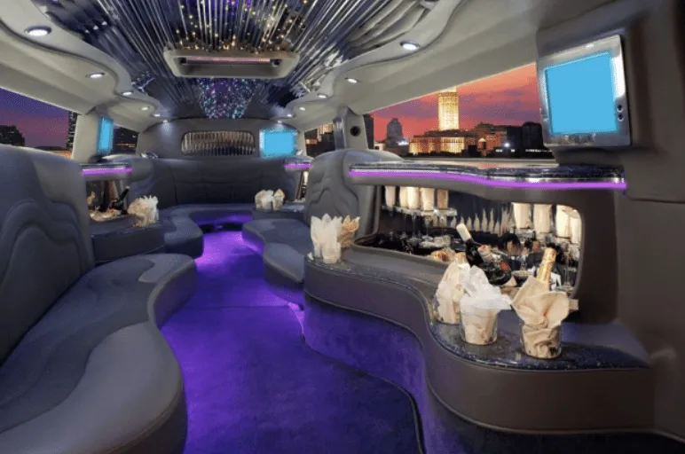 Hummer H2 interior with perimeter lounge seating, LED accent lighting and starlight or fiber-optic ceiling for wedding car rental