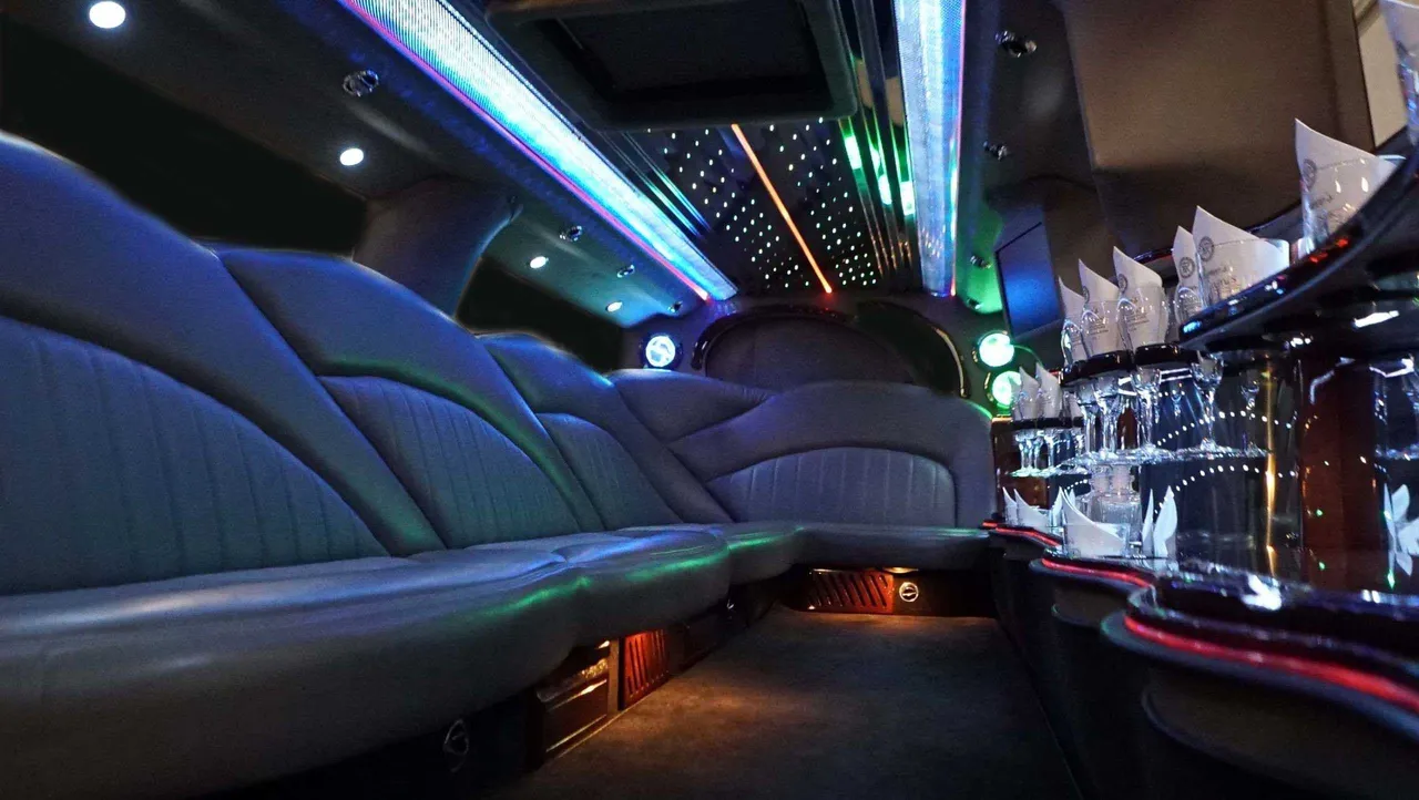 Hummer Limousine interior with LED accent lighting, LED ceiling lighting and starlight or fiber-optic ceiling for wedding car rental