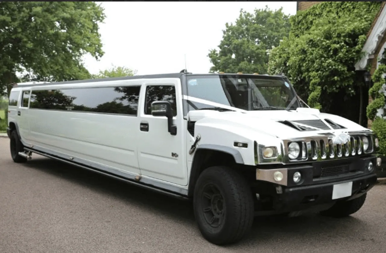 Hummer Limousine White Hummer Limousine with tinted windows for wedding car rental