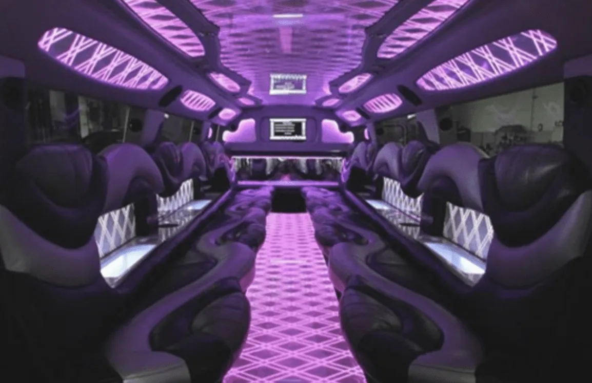 Hummer Limousine interior with perimeter lounge seating, LED accent lighting and LED ceiling lighting for wedding car rental