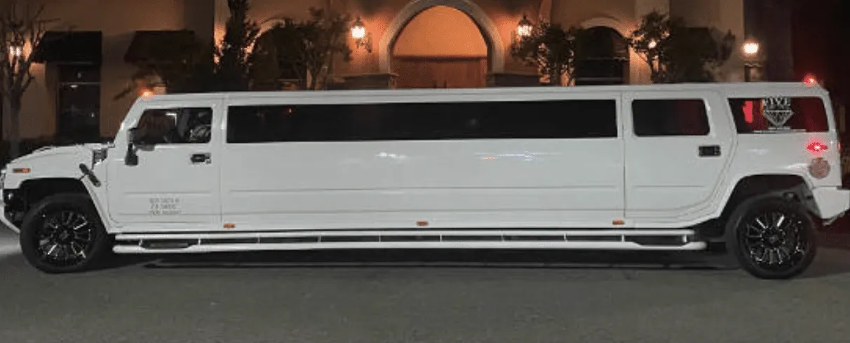 White Hummer Limousine with tinted windows for wedding car rental
