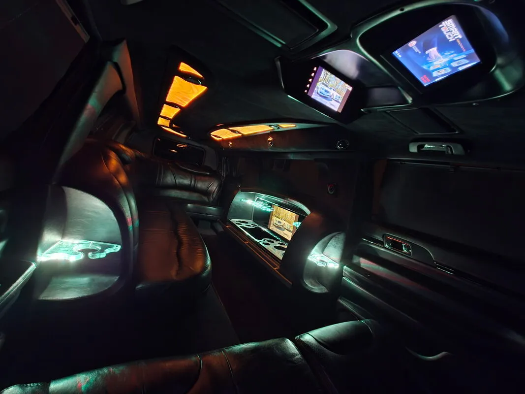 Lincoln MKT Limousine interior with LED accent lighting and TV screens, photo 2 for wedding car rental
