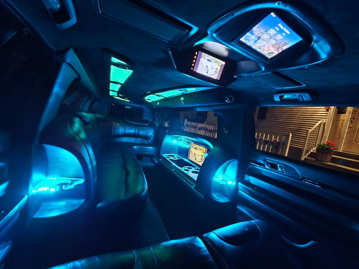 Lincoln MKT Limousine interior with LED accent lighting and TV screens for wedding car rental