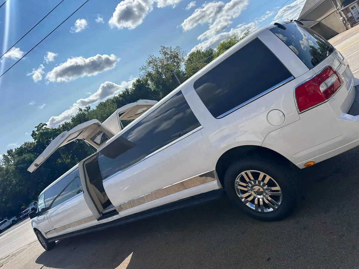 White 18 Passenger Lincoln Navigator exterior with tinted windows, photo 6 for wedding car rental