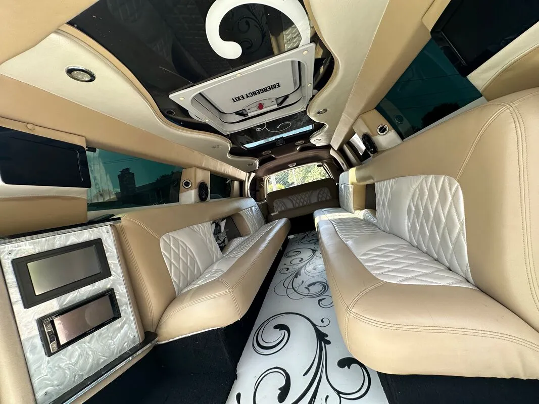 18 Passenger Lincoln Navigator interior with TV screens for wedding car rental