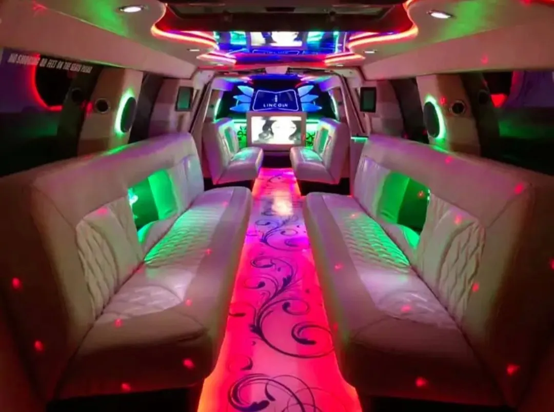 18 Passenger Lincoln Navigator interior with LED accent lighting and TV screens for wedding car rental