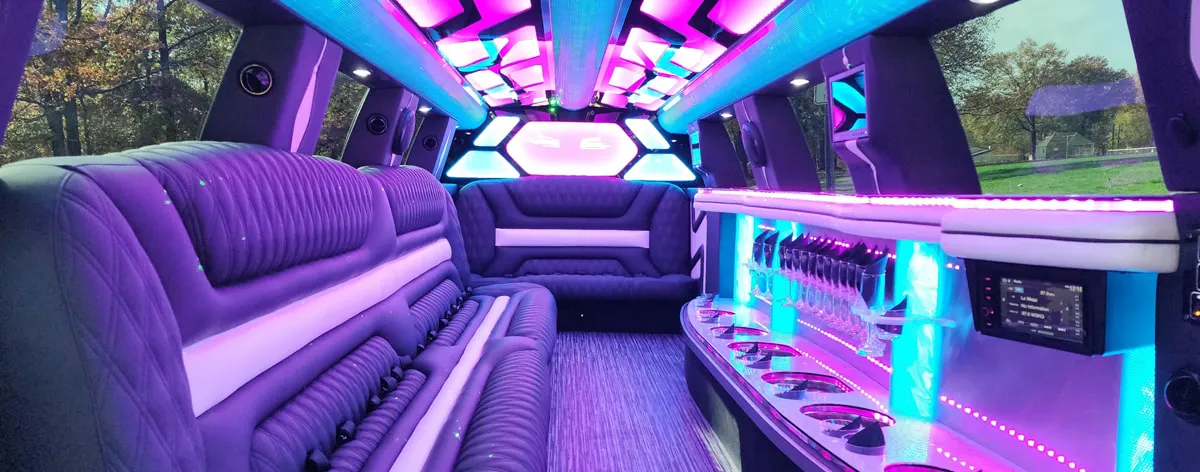 22 Passenger Lincoln Navigator 22 Passenger Lincoln Navigator interior with LED accent lighting, LED ceiling lighting and bar area for wedding car rental