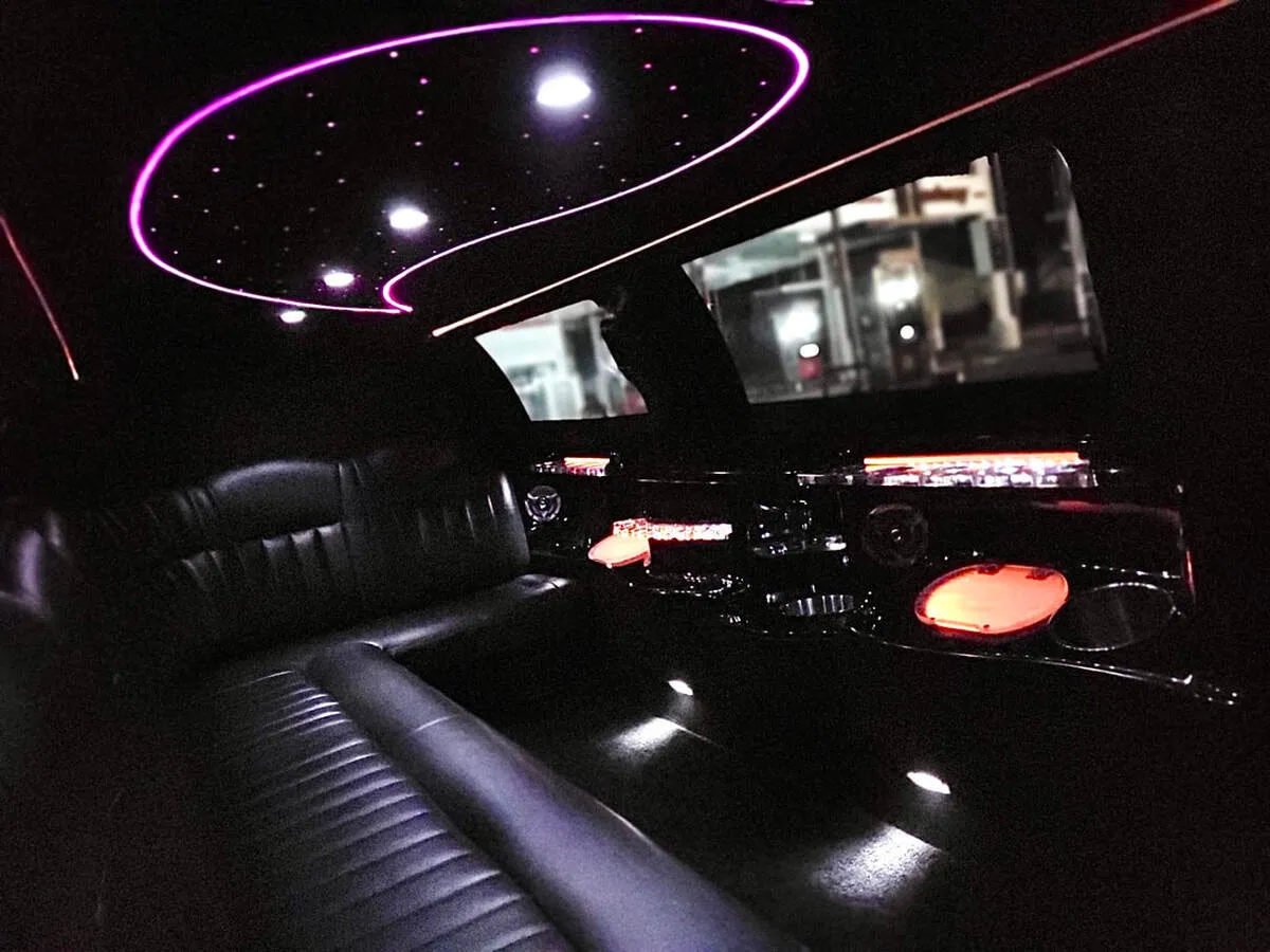 Lincoln Town Car Limousine interior with perimeter lounge seating and starlight or fiber-optic ceiling, photo 8 for wedding car rental in North Canton, CT