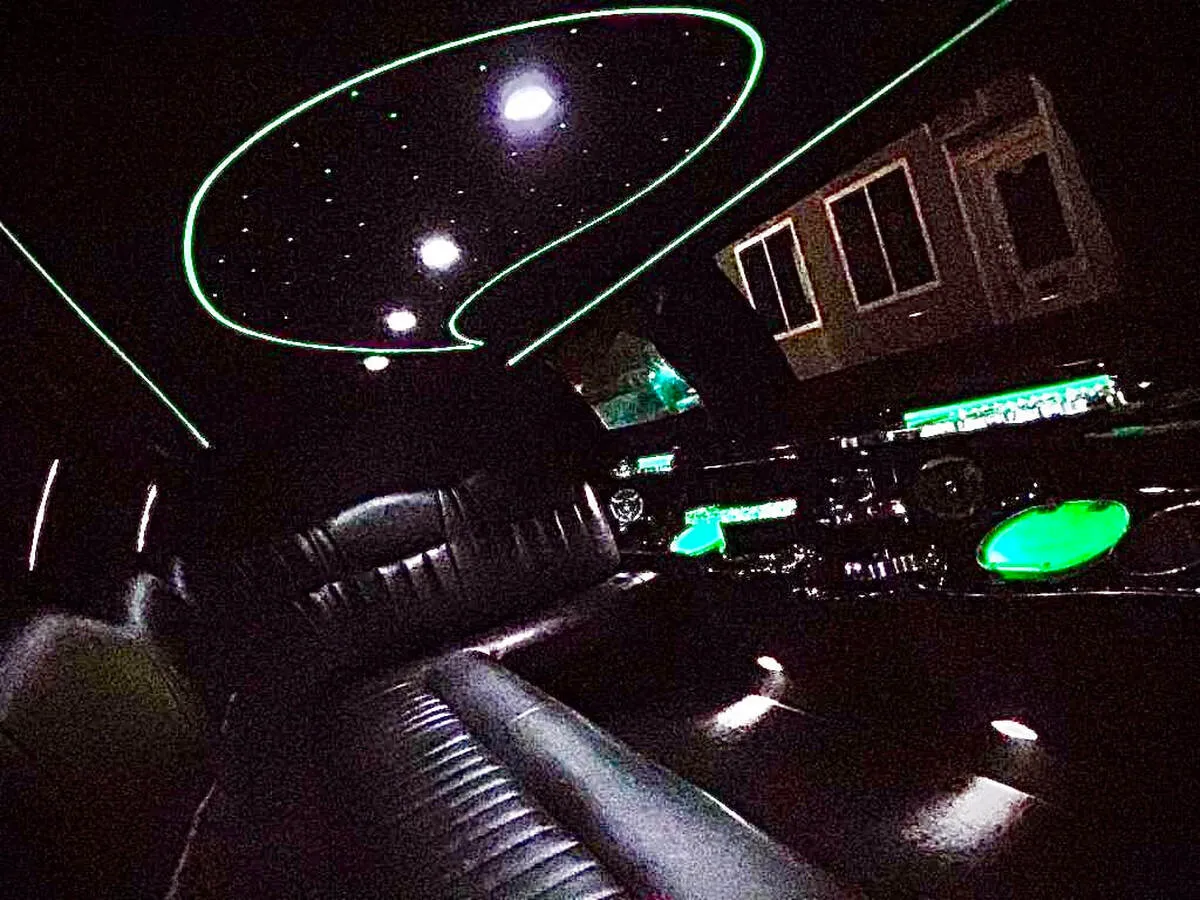 Lincoln Town Car Limousine interior with perimeter lounge seating and starlight or fiber-optic ceiling for wedding car rental in North Canton, CT