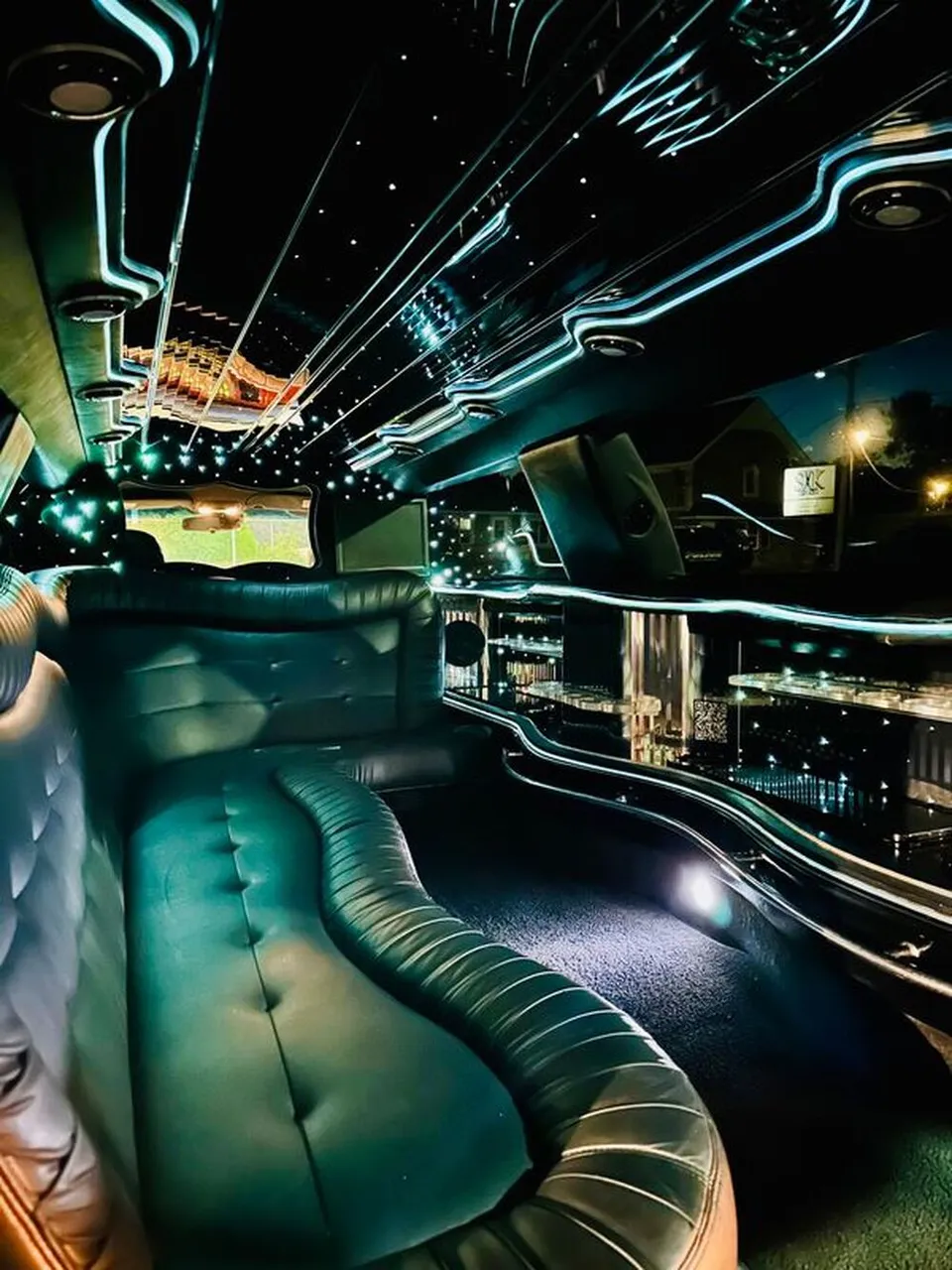 Lincoln Town Car Limousine interior with sofa-style seating, LED accent lighting and starlight or fiber-optic ceiling, photo 11 for wedding car rental in Windsor, CT