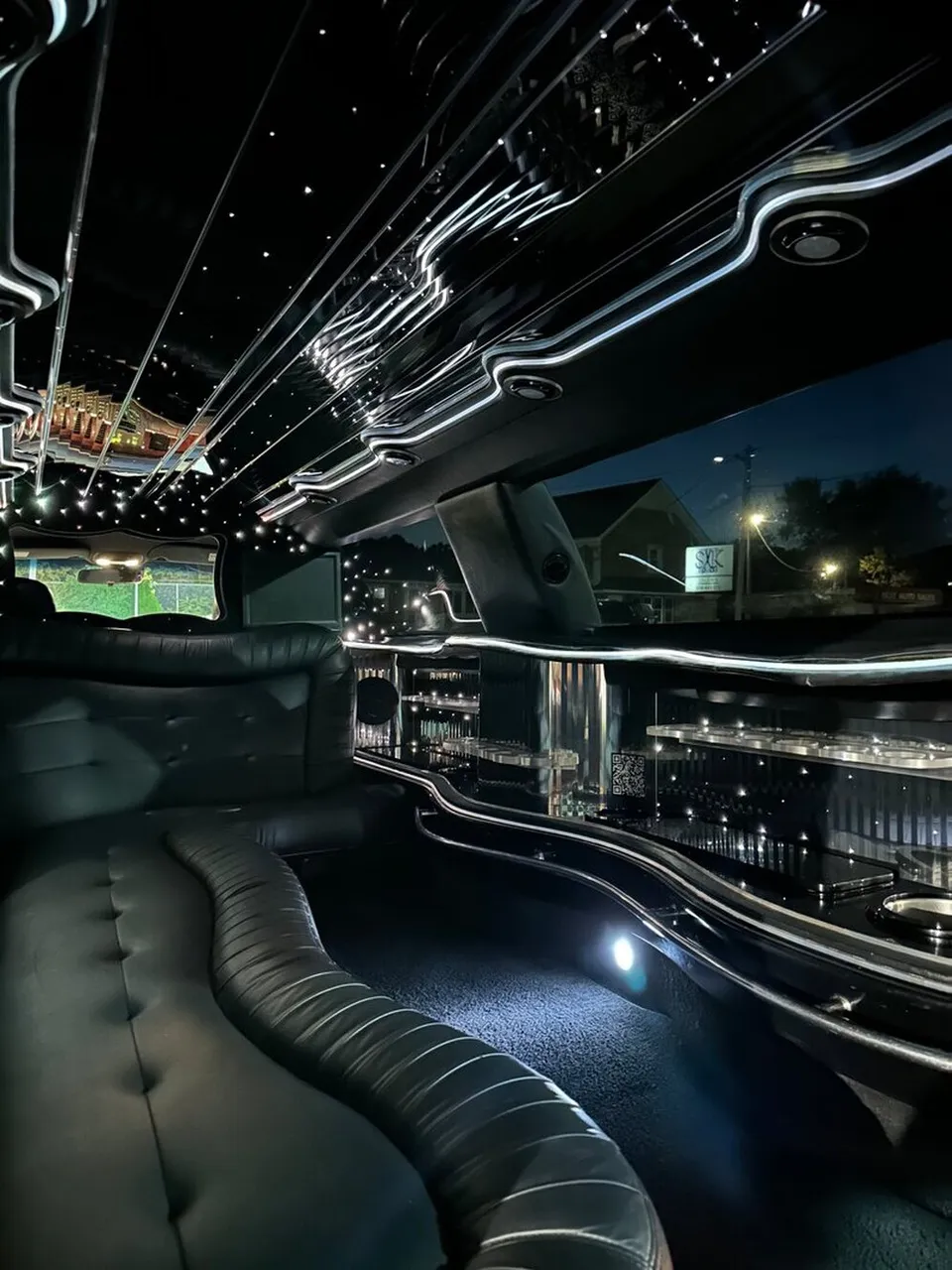 Lincoln Town Car Limousine interior with sofa-style seating, LED accent lighting and starlight or fiber-optic ceiling, photo 12 for wedding car rental in Windsor, CT