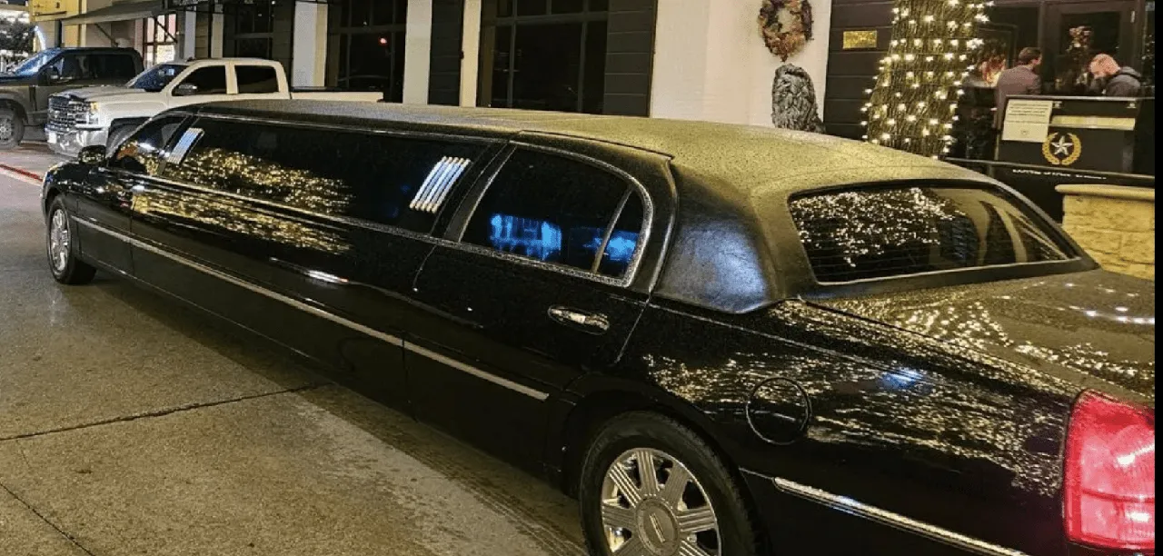 Black Lincoln Town Car with tinted windows for wedding car rental
