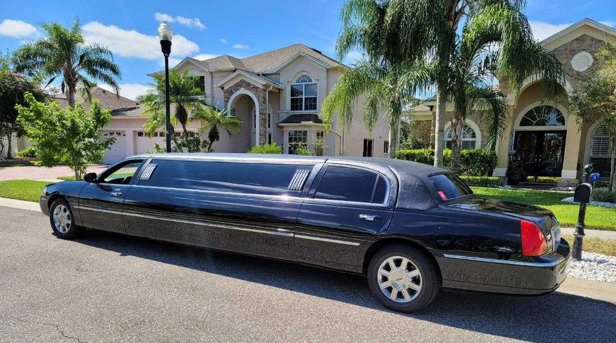 Lincoln Town Car Limousine Black Lincoln Town Car Limousine with tinted windows for wedding car rental