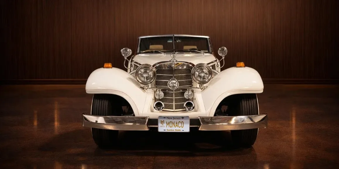 White Mercedes-Benz 500K exterior with convertible roof for wedding car rental in Toms River, NJ