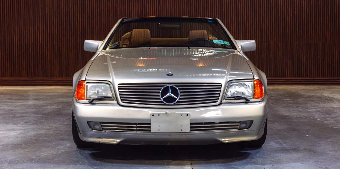 Silver Mercedes-Benz SL500 exterior with convertible roof for wedding car rental in Toms River, NJ