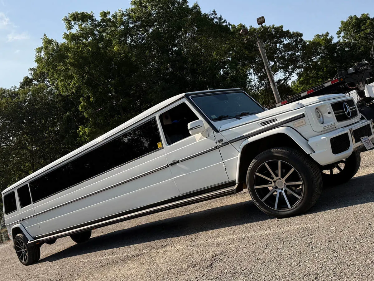 White Mercedes-Benz G Wagon with tinted windows for wedding car rental