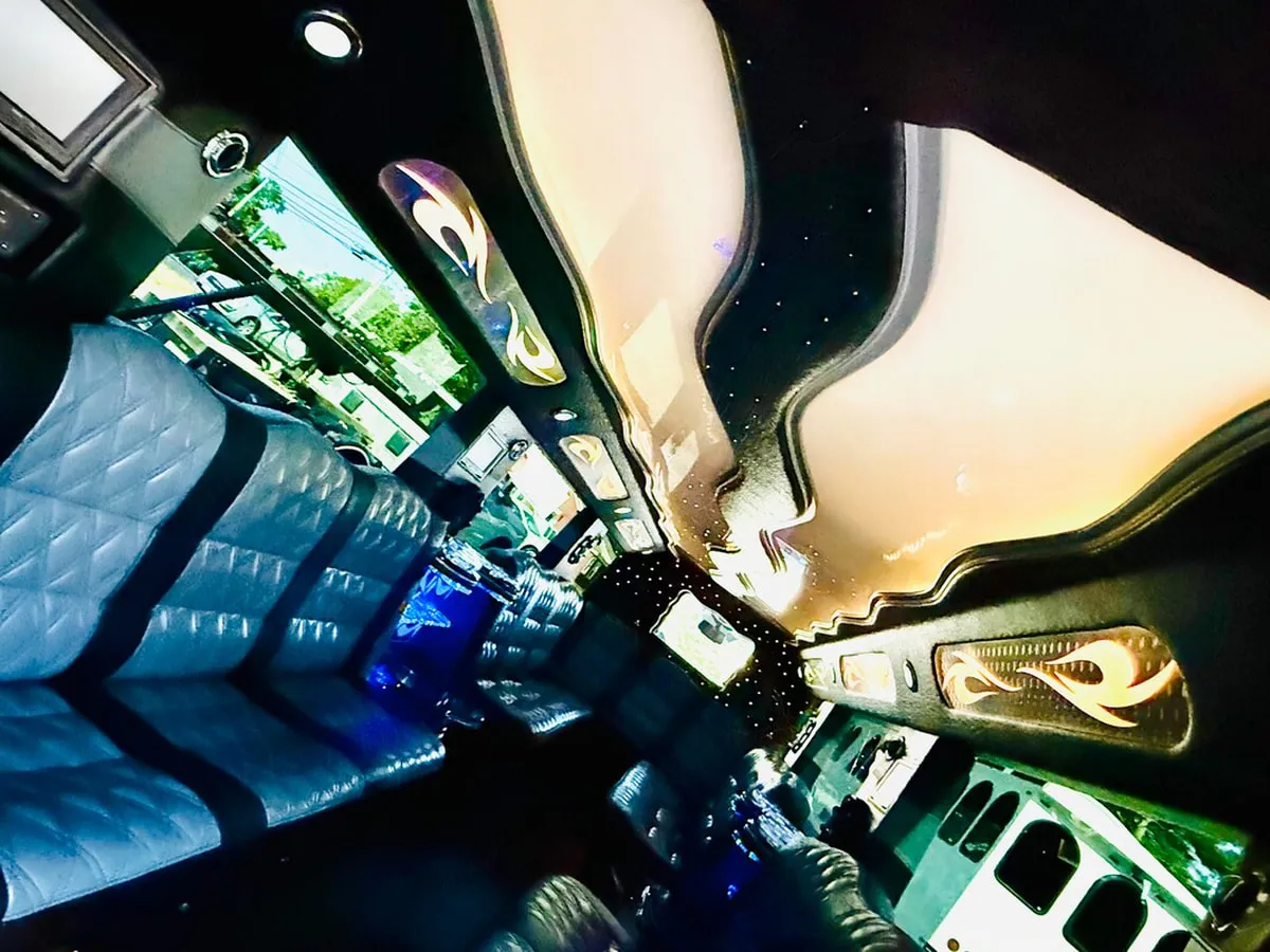 Mercedes-Benz G Wagon interior with perimeter lounge seating, LED ceiling lighting and starlight or fiber-optic ceiling, photo 12 for wedding car rental