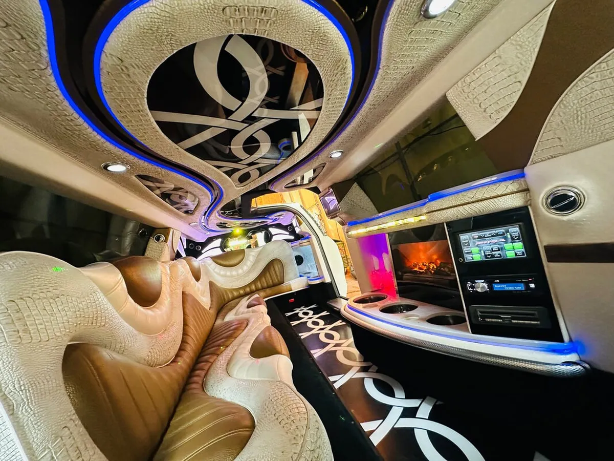 Mercedes-Benz Jet Doors Limousine interior with perimeter lounge seating and LED accent lighting, photo 11 for wedding car rental in Capitol Planning Region, CT