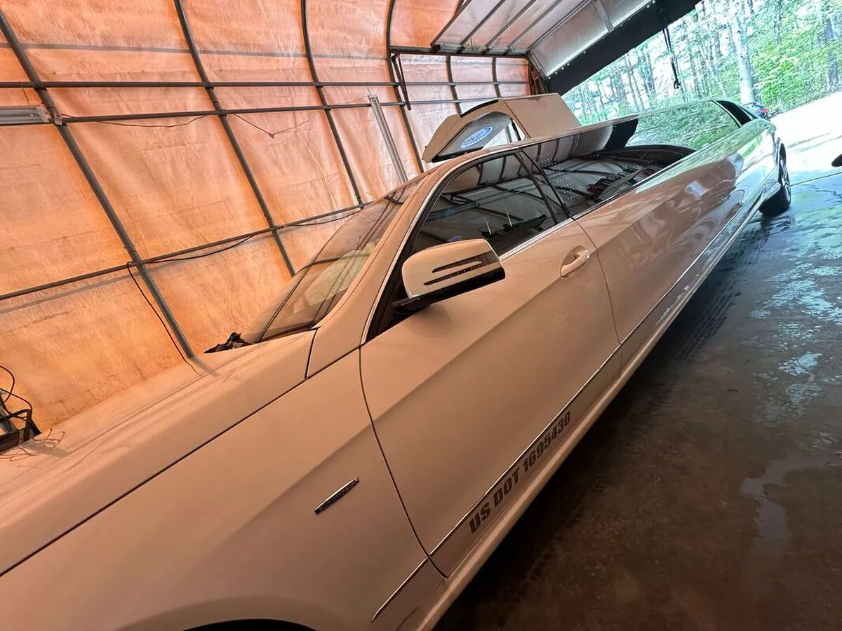White Mercedes-Benz Jet Doors Limousine exterior with tinted windows for wedding car rental in Capitol Planning Region, CT