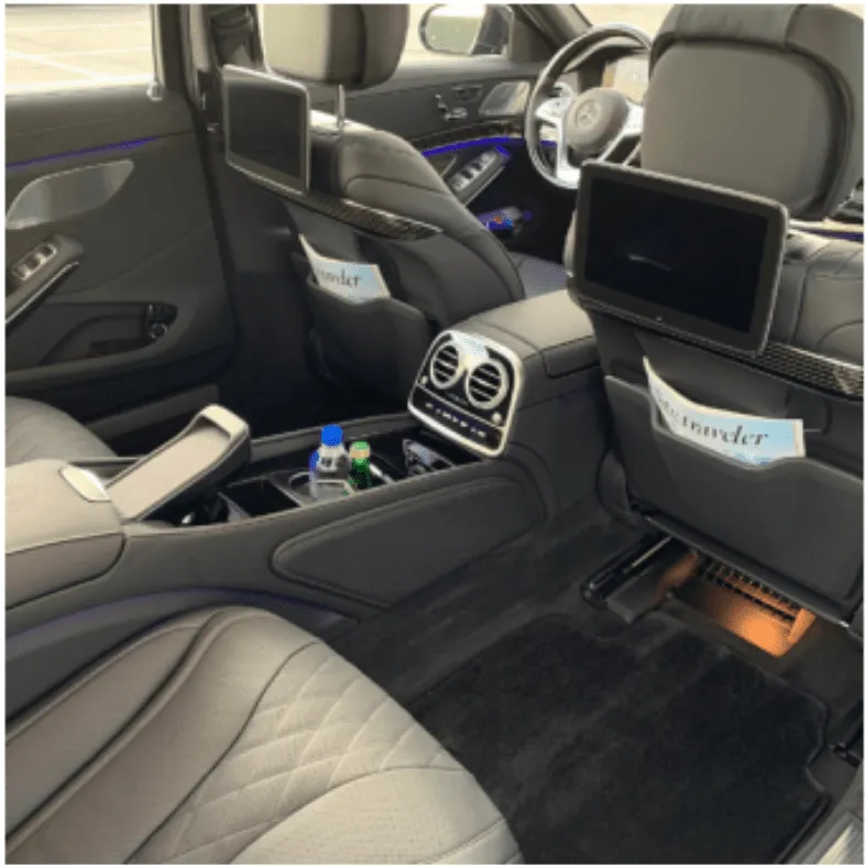 Mercedes-Maybach interior with cup holders, LED accent lighting and rear-seat entertainment screens for wedding car rental