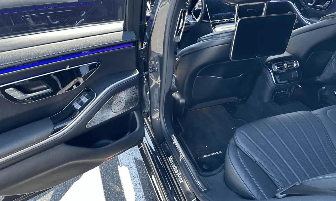 Mercedes S Class interior with LED accent lighting and rear-seat entertainment screens for wedding car rental