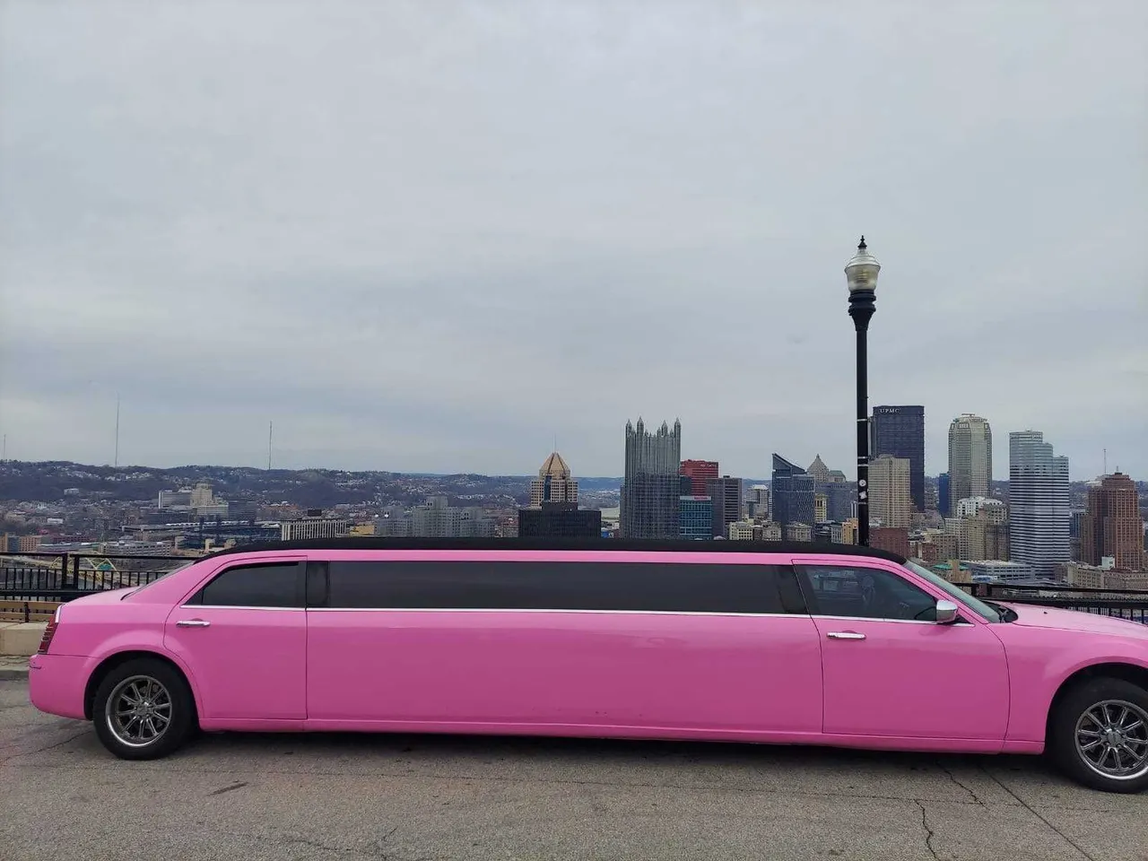 Pink Limousine with tinted windows for wedding car rental