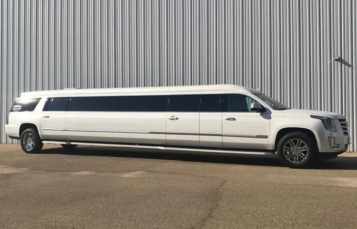 White Cadillac Escalade Limousine for wedding car rental